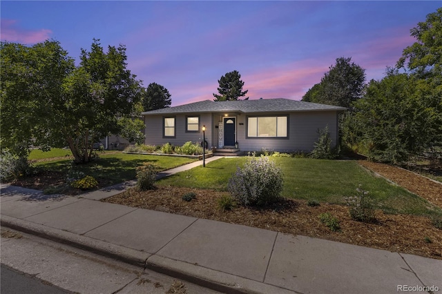 view of front of property with a lawn