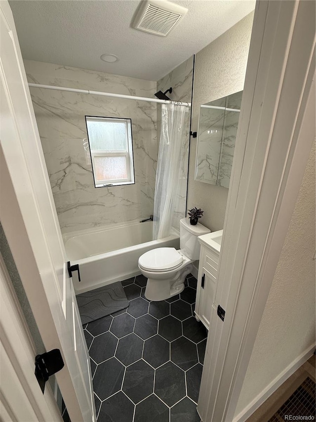 1694 Xanthia St, Denver, CO 80220 - full bath with shower / tub combo with curtain, toilet, a textured wall, vanity, and a textured ceiling
