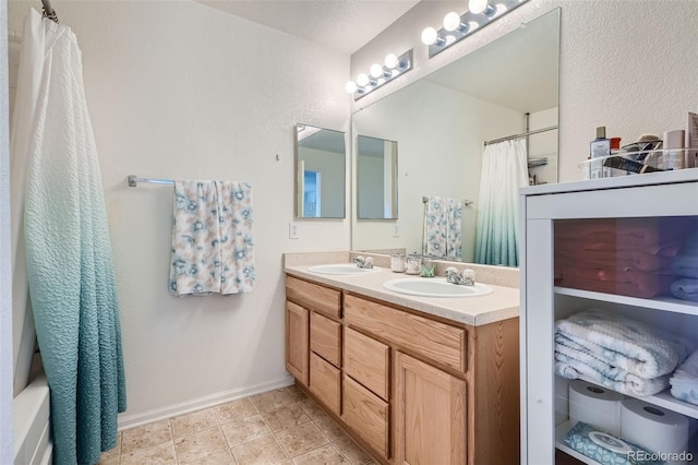 bathroom featuring vanity and shower / tub combo with curtain