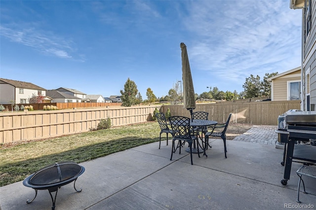 view of patio / terrace with a fire pit