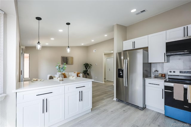 kitchen featuring decorative backsplash, light countertops, white cabinets, and stainless steel appliances