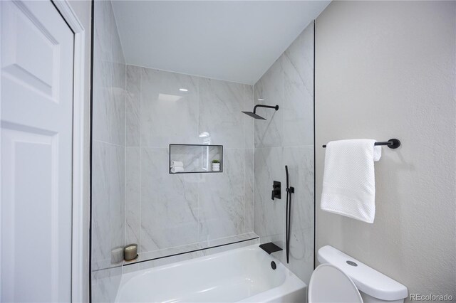 bathroom featuring toilet and bathtub / shower combination