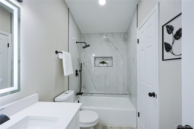 bathroom with toilet, vanity, and washtub / shower combination