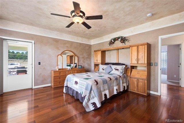 bedroom with dark wood-type flooring, ceiling fan, and multiple windows