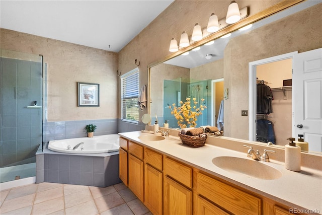 bathroom with vanity, tile patterned floors, and separate shower and tub