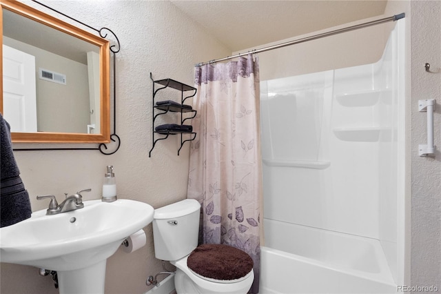 full bathroom featuring shower / bath combo, sink, and toilet