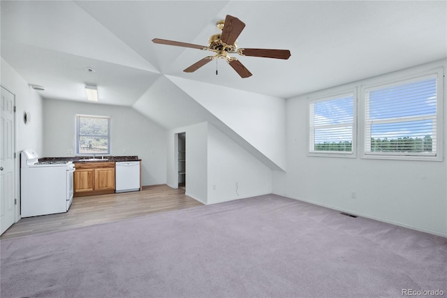 bonus room featuring ceiling fan, light colored carpet, and vaulted ceiling