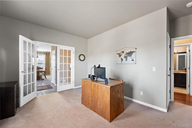 home office featuring french doors and carpet flooring