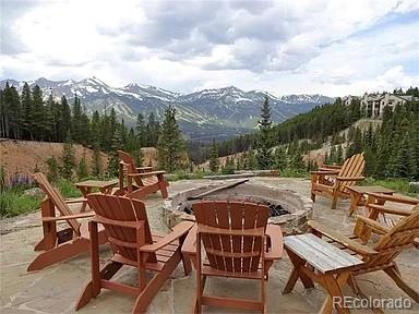 59 Club House Road 1/2Quarter Share D, Breckenridge, CO 80424 - view of patio featuring a mountain view, a fire pit, and a forest view
