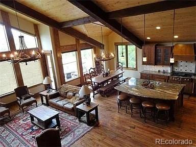 59 Club House Road 1/2Quarter Share D, Breckenridge, CO 80424 - living room with a chandelier, dark wood finished floors, and wood ceiling