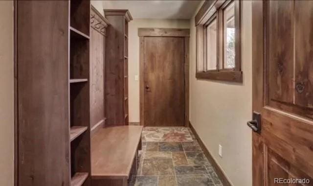 59 Club House Road 1/2Quarter Share D, Breckenridge, CO 80424 - mudroom with baseboards and stone finish floors