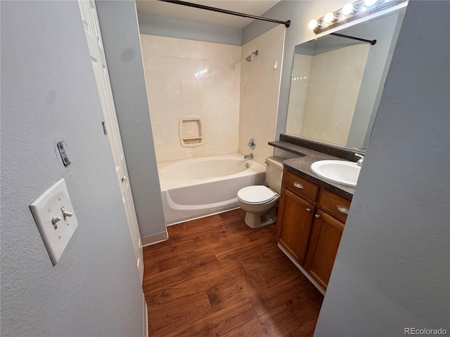 full bathroom with toilet, vanity, bathtub / shower combination, and hardwood / wood-style floors