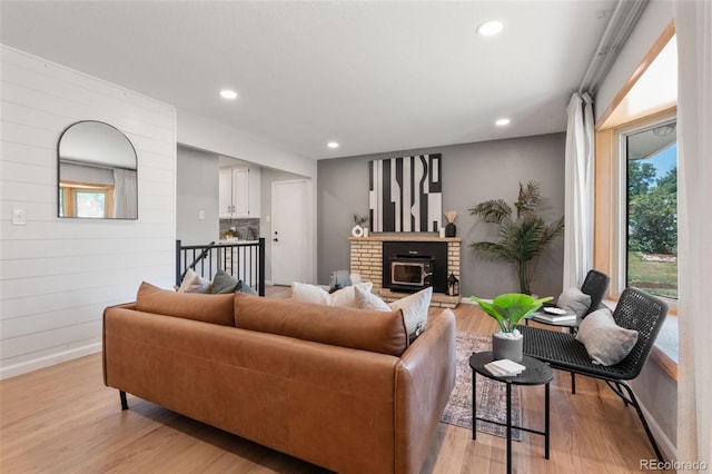 2963 S Vrain St, Denver, CO 80236 - living area featuring light wood-style flooring, recessed lighting, and a brick fireplace