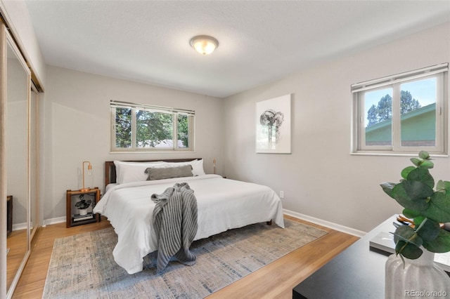 2963 S Vrain St, Denver, CO 80236 - bedroom with light wood-style flooring and baseboards
