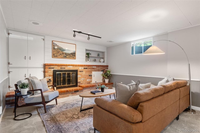 2963 S Vrain St, Denver, CO 80236 - living area featuring a fireplace, rail lighting, and carpet flooring