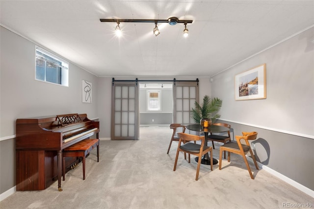2963 S Vrain St, Denver, CO 80236 - dining area with a barn door, rail lighting, light colored carpet, and ornamental molding