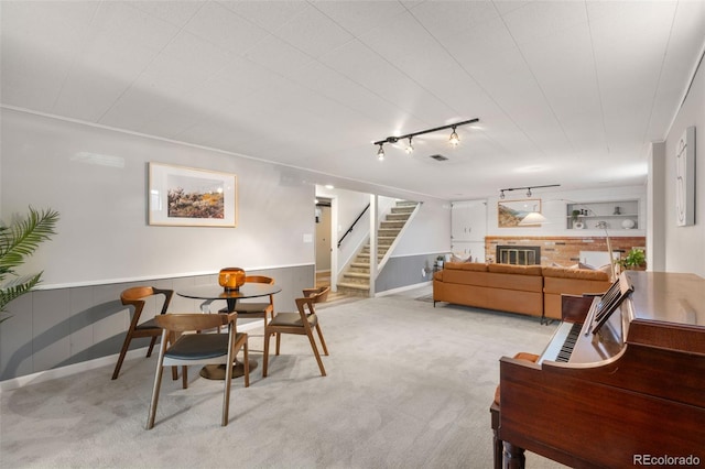 2963 S Vrain St, Denver, CO 80236 - dining room featuring stairway, rail lighting, light colored carpet, and a wainscoted wall