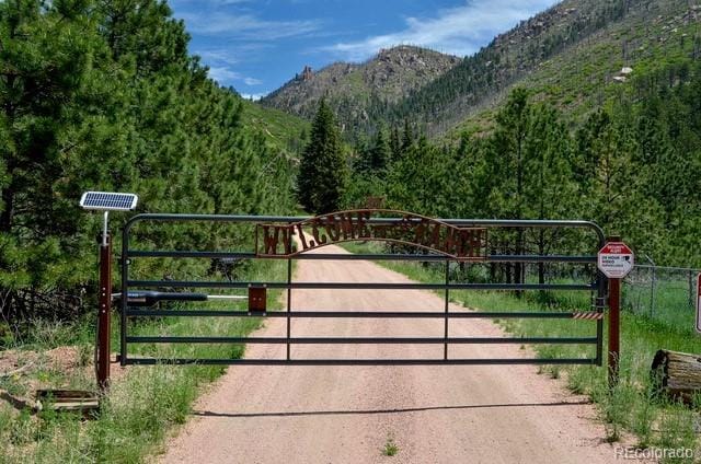 5975 Wellington Rd, Cascade, CO 80809 - gate featuring a mountain view
