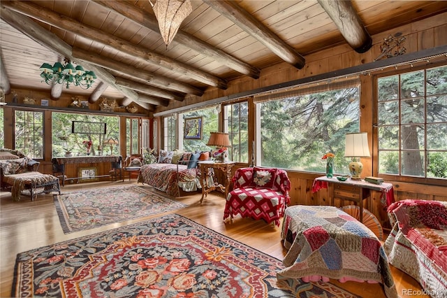 5975 Wellington Rd, Cascade, CO 80809 - sunroom / solarium with wood ceiling, wood finished floors, wooden walls, and a wooden deck