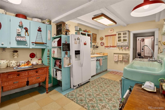 5975 Wellington Rd, Cascade, CO 80809 - kitchen with white appliances, a textured ceiling, and light flooring