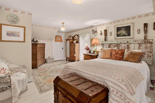 5975 Wellington Rd, Cascade, CO 80809 - bedroom with wallpapered walls and light wood-type flooring