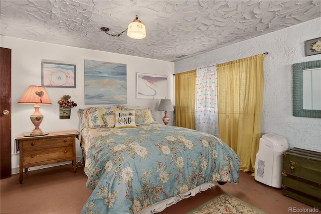 5975 Wellington Rd, Cascade, CO 80809 - carpeted bedroom featuring a textured wall