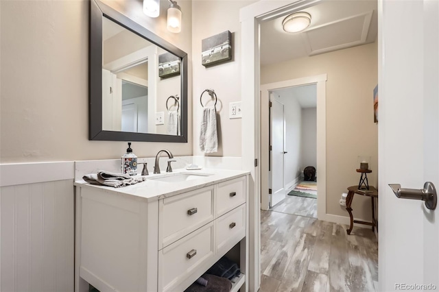 3144 S Wheeling Way Unit 401, Aurora, CO 80014 - bathroom with wood finished floors, vanity, and baseboards