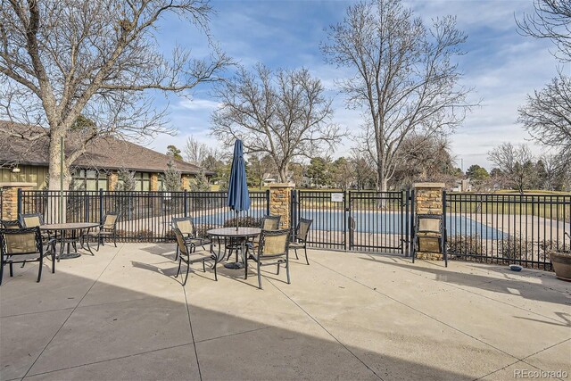 3144 S Wheeling Way Unit 401, Aurora, CO 80014 - view of patio / terrace featuring outdoor dining area, fence, and a water view