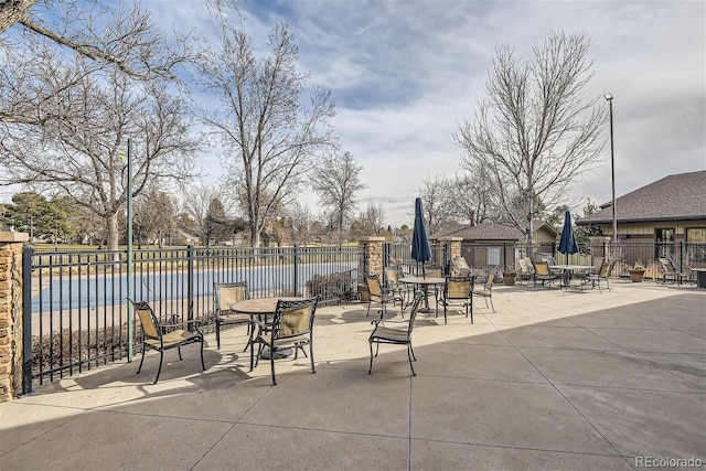 3144 S Wheeling Way Unit 401, Aurora, CO 80014 - view of patio / terrace with fence and a water view