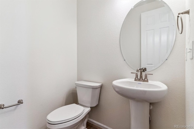 bathroom featuring toilet