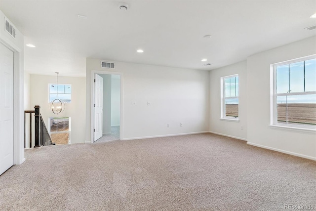 unfurnished room with carpet floors