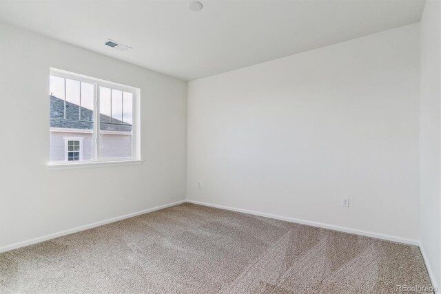 empty room with carpet flooring