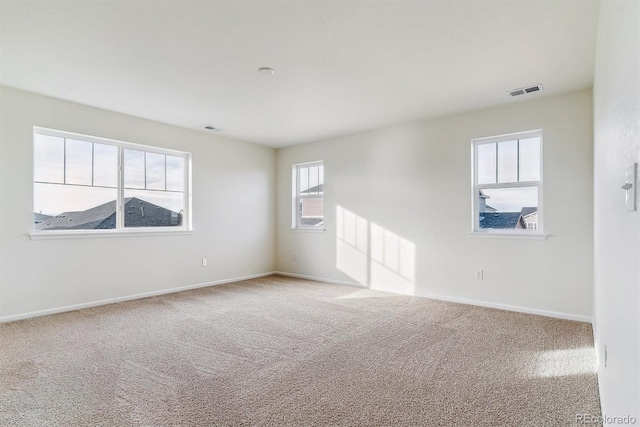 unfurnished room with carpet flooring