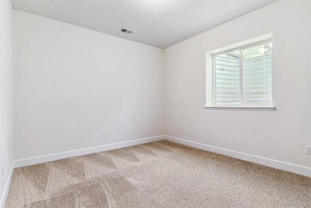 unfurnished room featuring carpet flooring