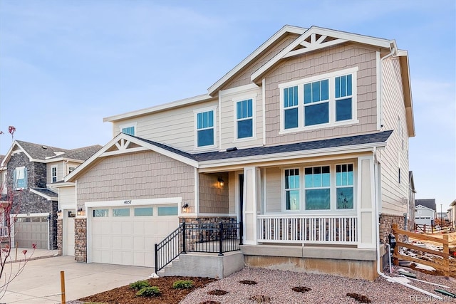 craftsman inspired home with a porch and a garage