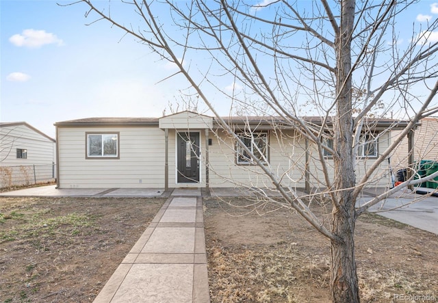 single story home featuring fence and a patio