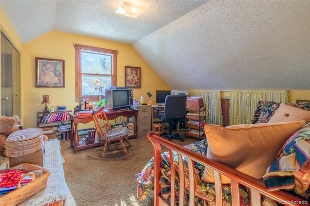 office area with a textured ceiling, carpet floors, and lofted ceiling