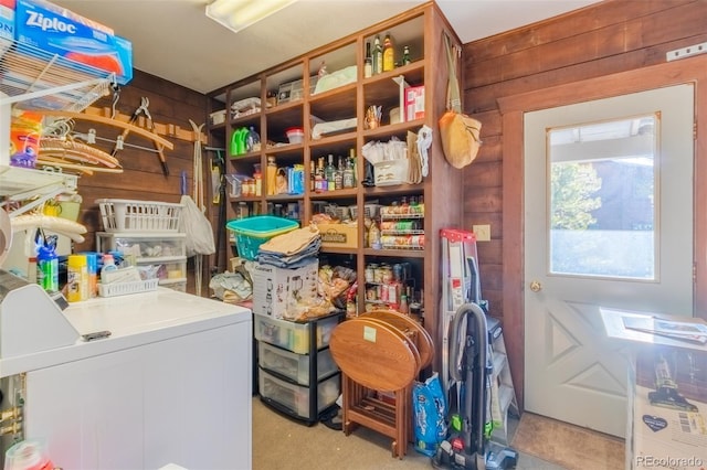 storage room featuring washing machine and clothes dryer