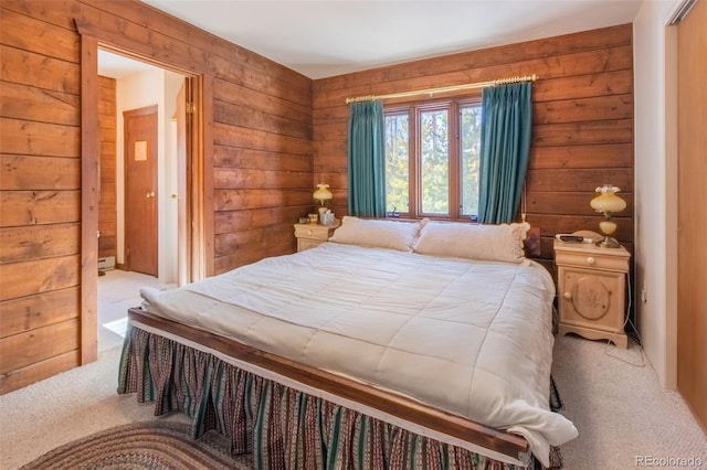 bedroom featuring wood walls and light carpet