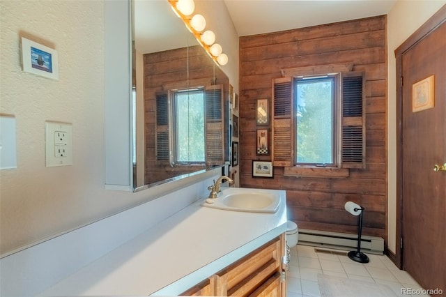 bathroom featuring a baseboard radiator, tile patterned flooring, wood walls, toilet, and vanity