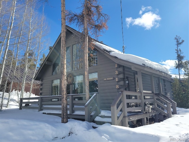 view of snow covered house