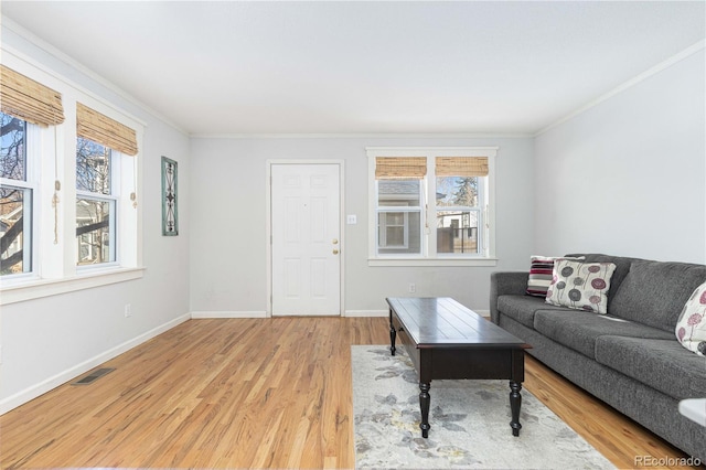 living room featuring ornamental molding and wood-type flooring