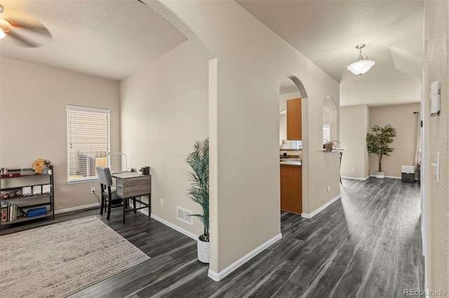 corridor featuring dark hardwood / wood-style floors