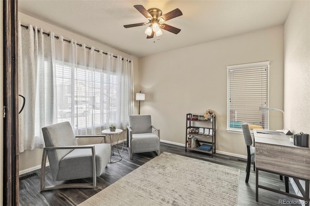 living area with dark hardwood / wood-style floors and ceiling fan