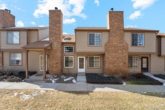 exterior space with entry steps and a chimney