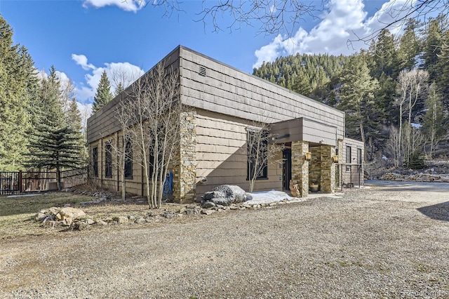 view of property exterior featuring fence