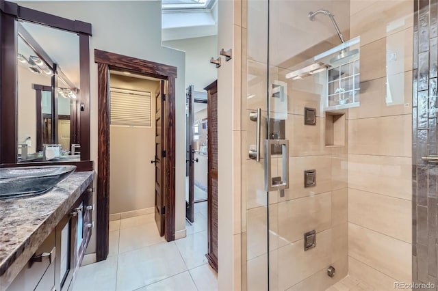 full bath with a shower stall, tile patterned floors, and vanity