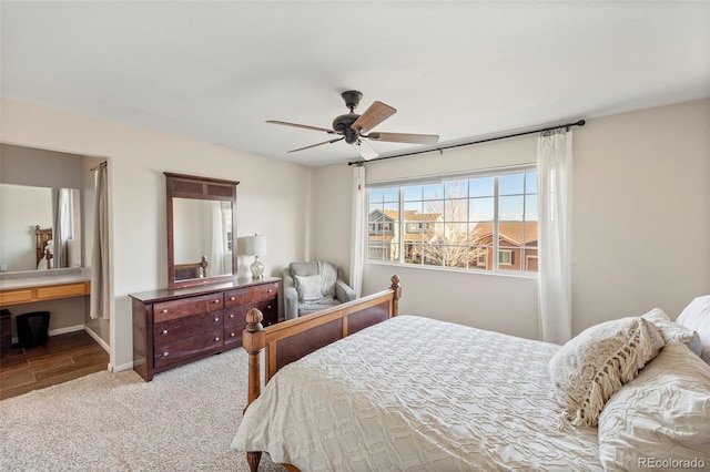 carpeted bedroom featuring ceiling fan and baseboards