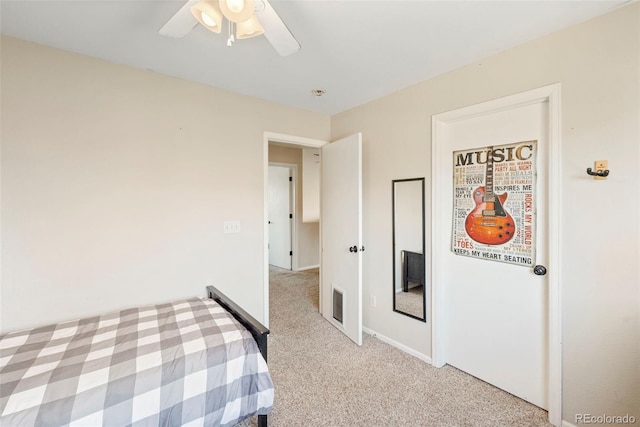 bedroom featuring light colored carpet and ceiling fan