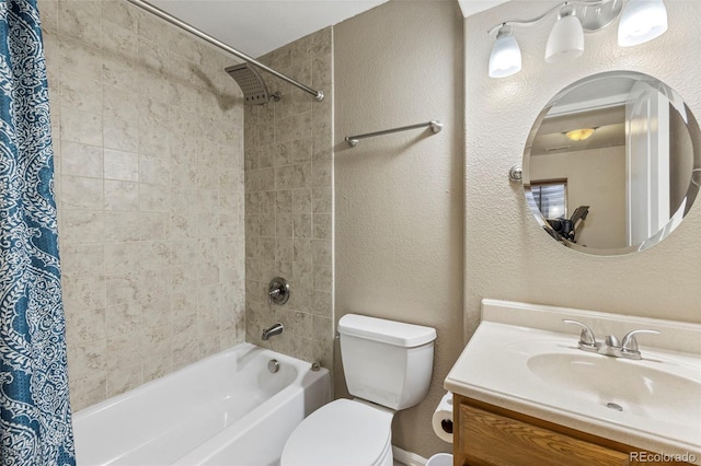 full bath featuring shower / tub combo with curtain, a textured wall, vanity, and toilet